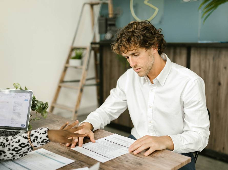 Man and woman reviewing documents together.